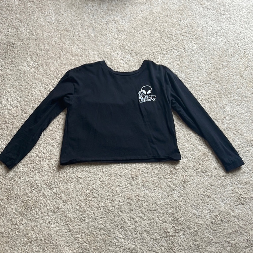 A black long sleeved shirt, included with alien graphics on the front and back